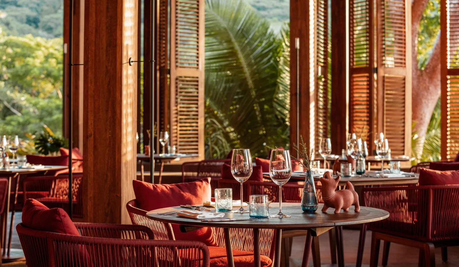 Wooden tables and woven chairs in Alma’s dining room