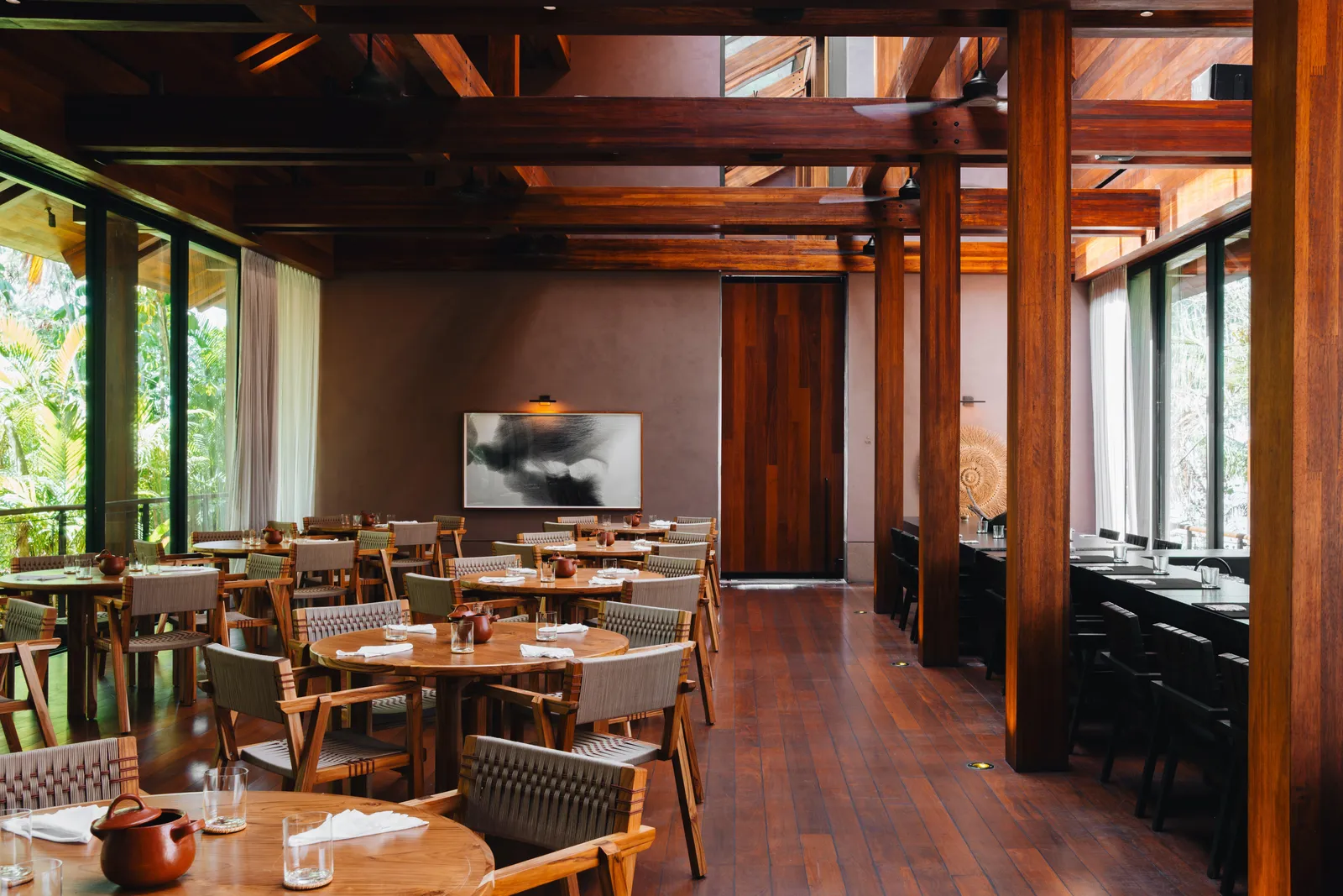 Carao’s dining room with timber beams, tables and windows