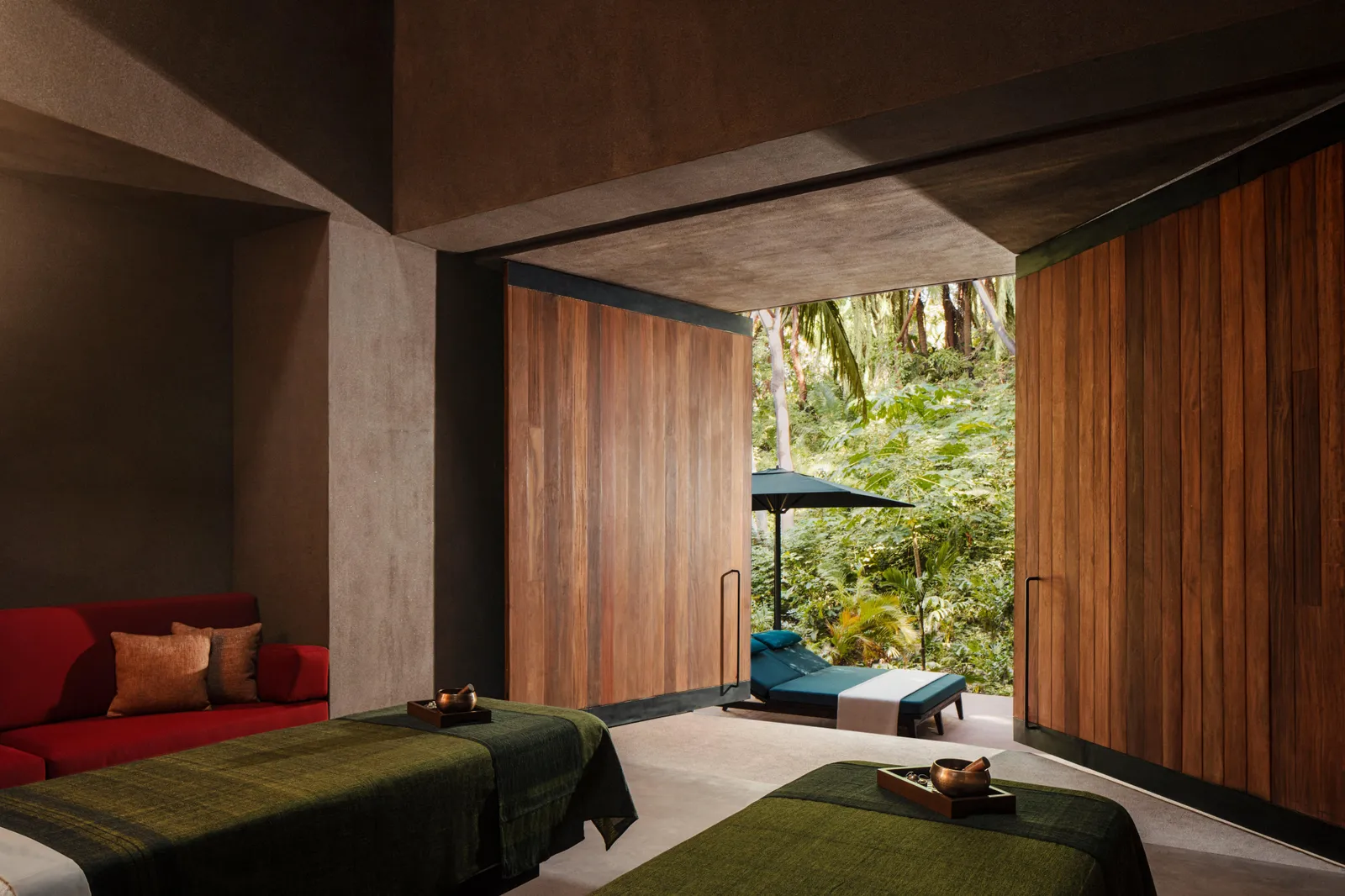 2 treatment beds with doors opening onto a forest terrace