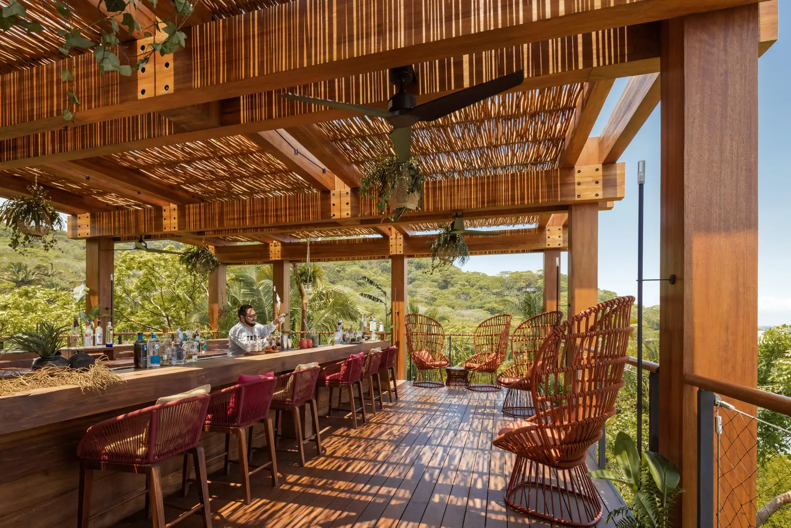 The Treetop’s counter and red chairs, open to the forest