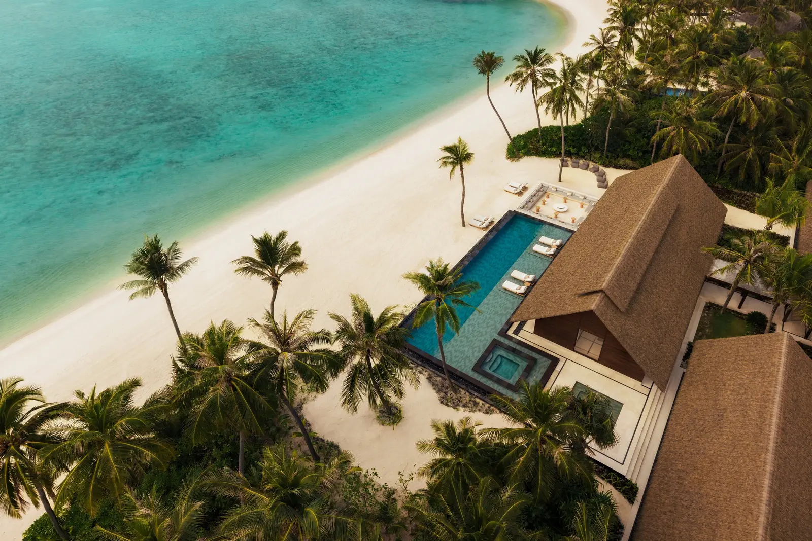 The Grand Beach Villa With Pool from the air, its pool before the beach