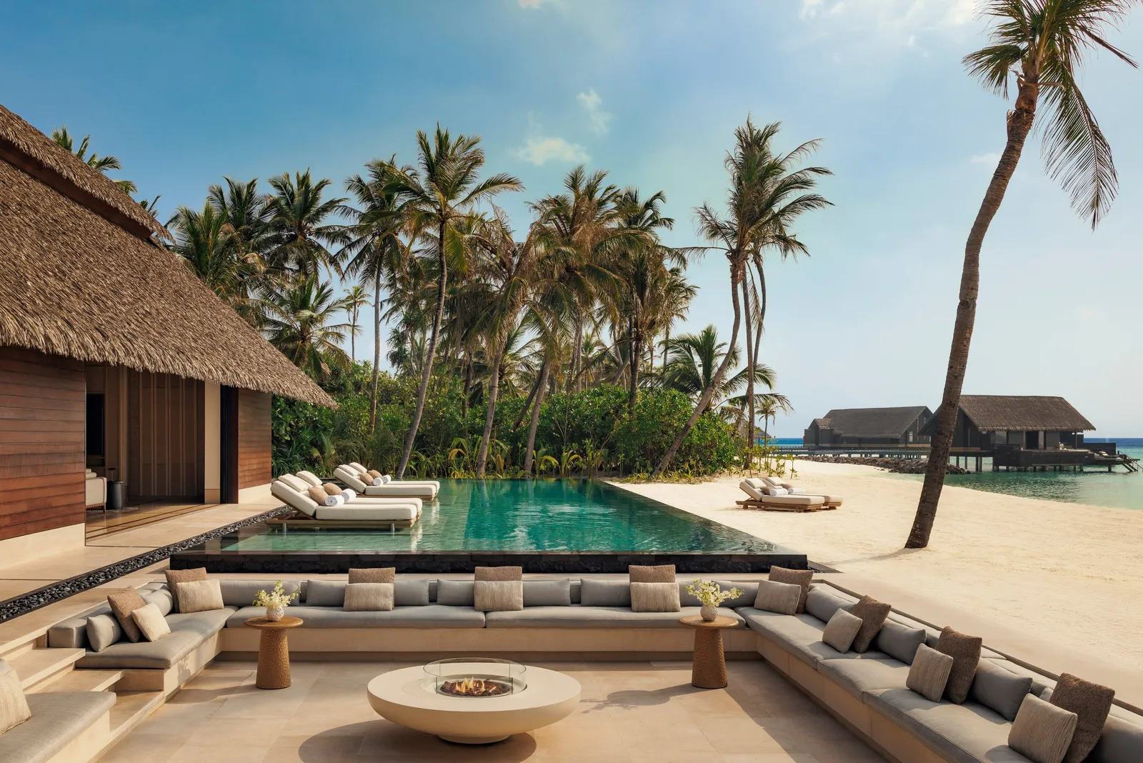 The Grand Residence’s pool and fire pit, the beach behind