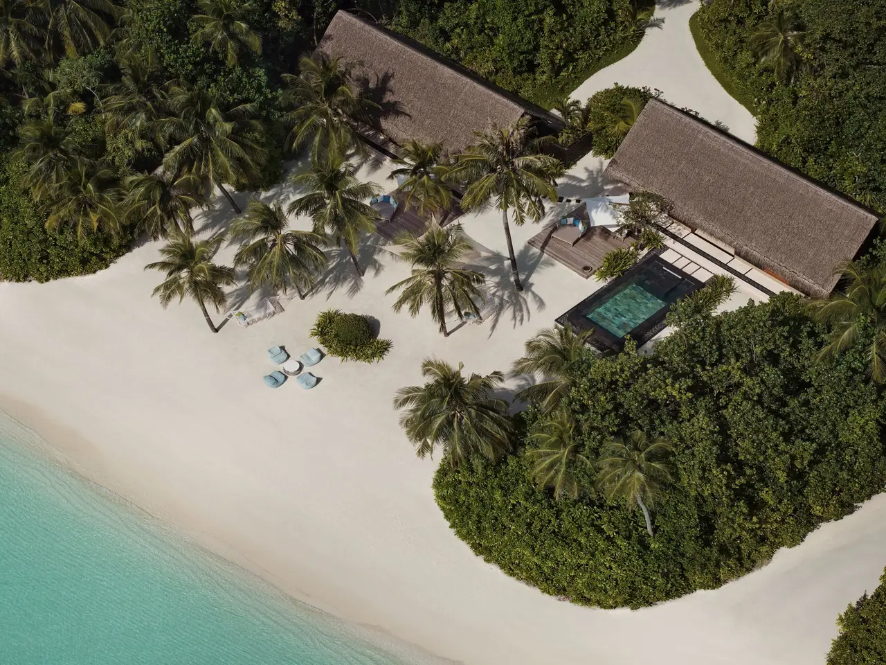 The Two Villa Residence with Pool from the air: 2 roofs and the pool in the greenery