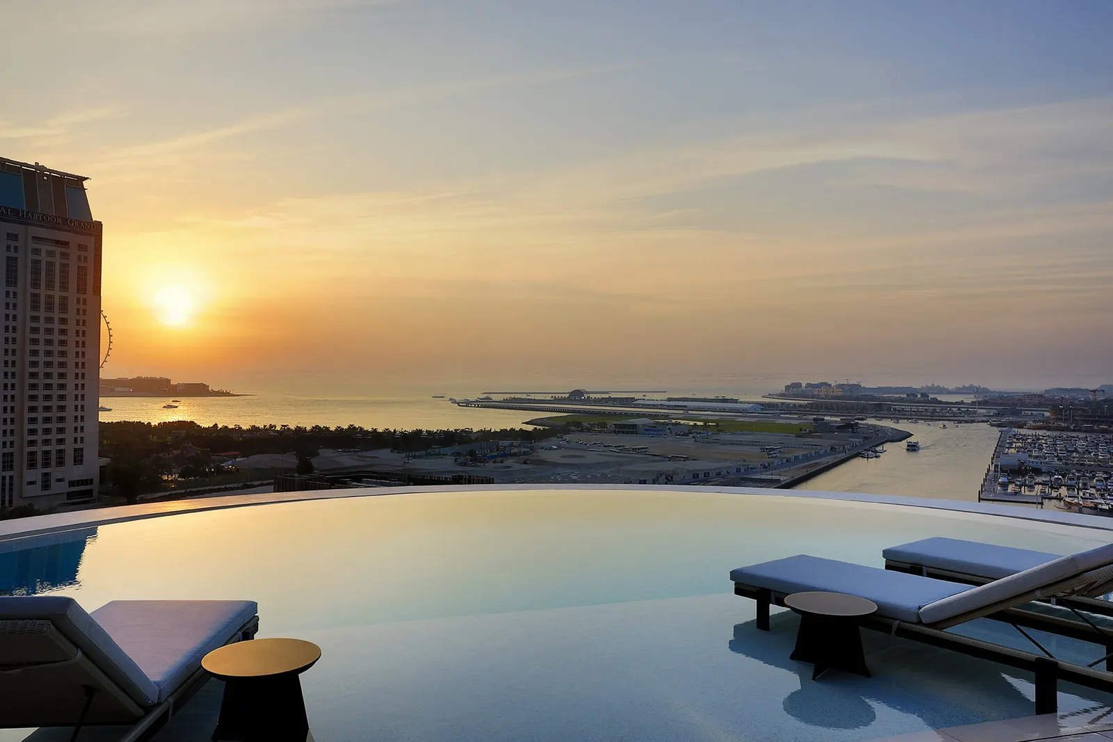 The Ciel Dubai Marina pool overlooking Palm Jumeirah at sunset