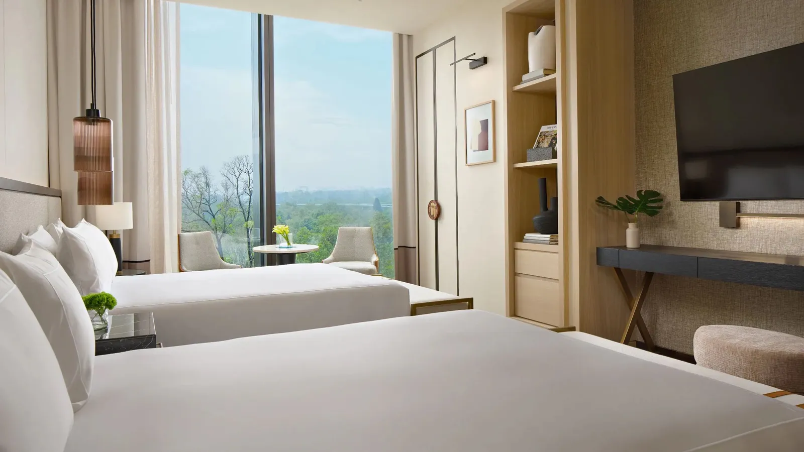 A Park Hyatt Mexico City room with the park’s trees through the window