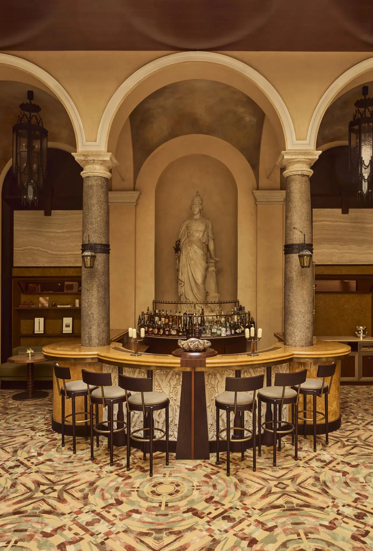 The bar counter before Rinaldo Rinaldi’s marble Minerva in her niche