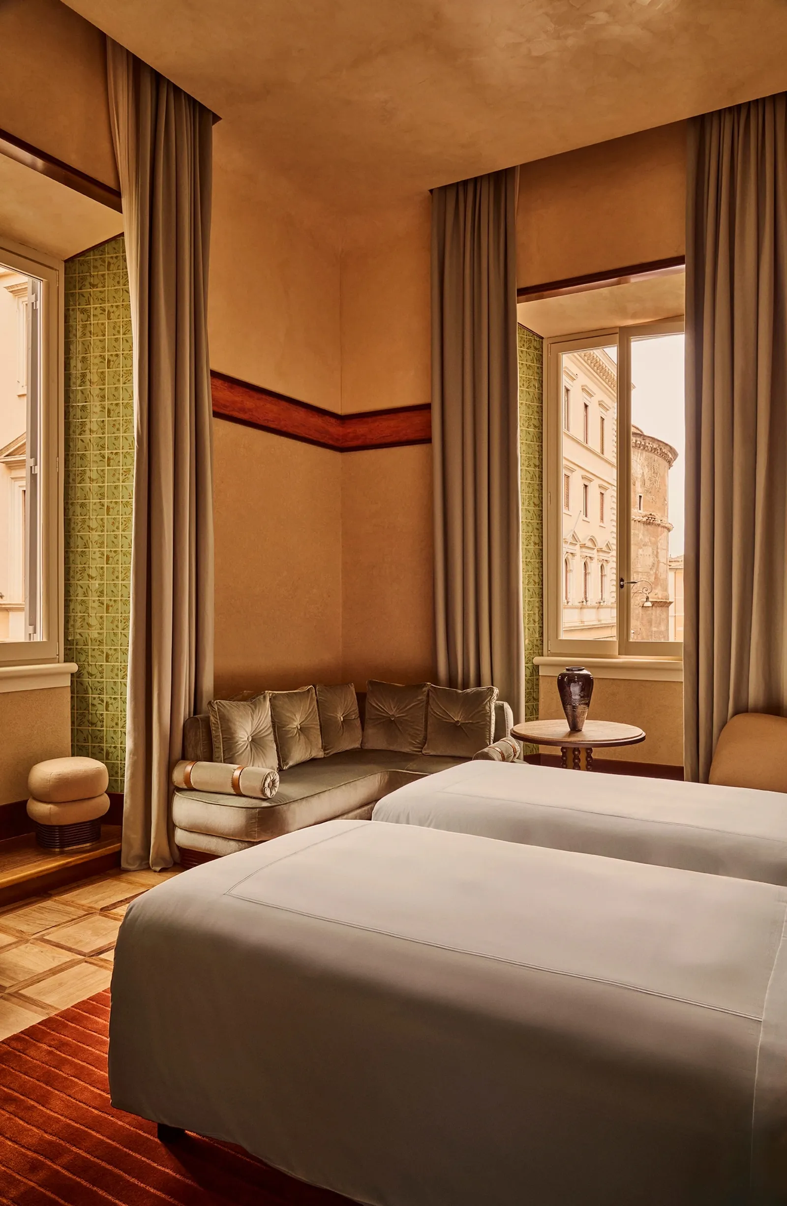 A Grand Deluxe Room with twin beds and the window on Piazza della Minerva