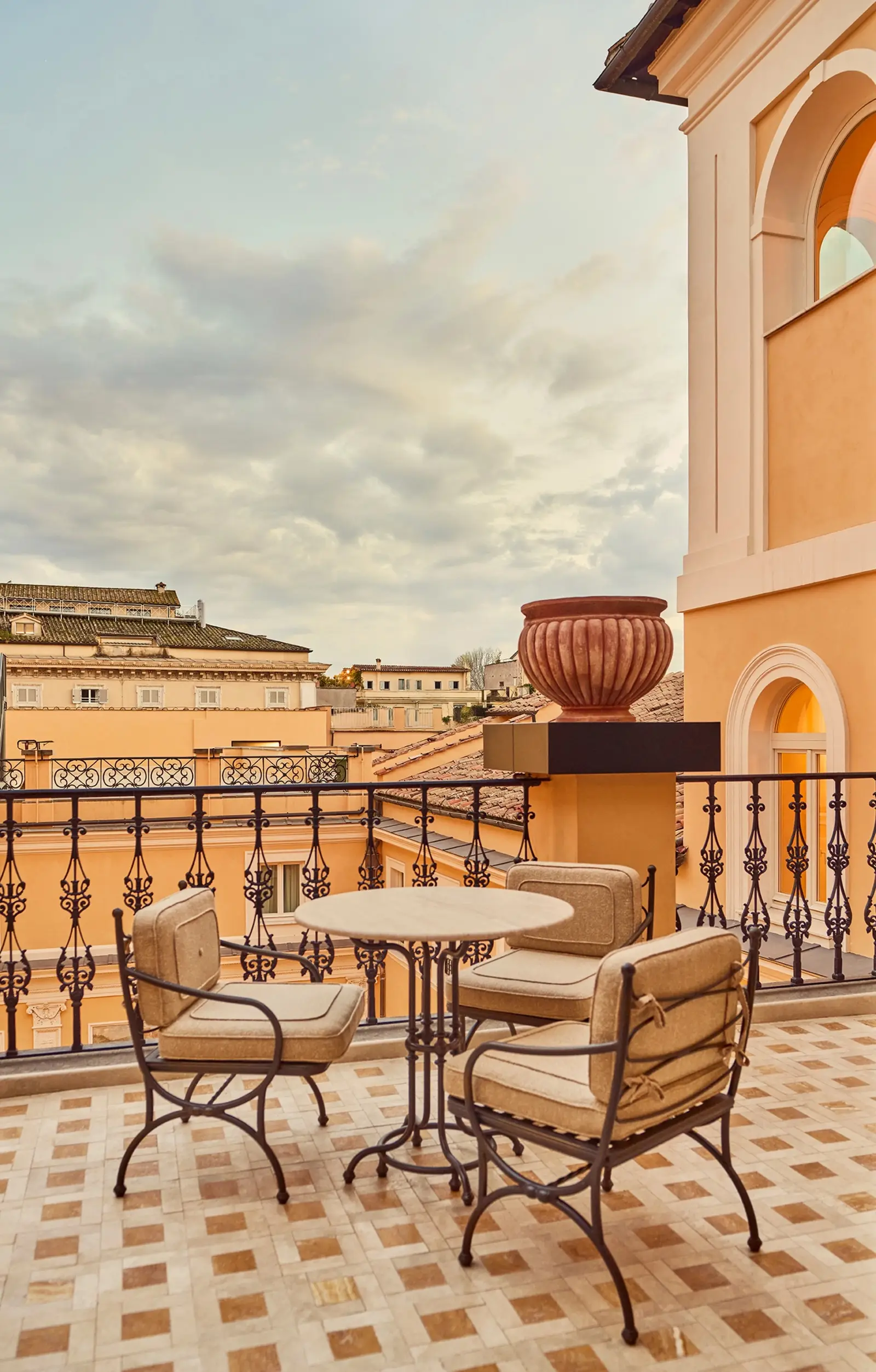 The Junior Suite’s private terrace, with a round table and 2 chairs