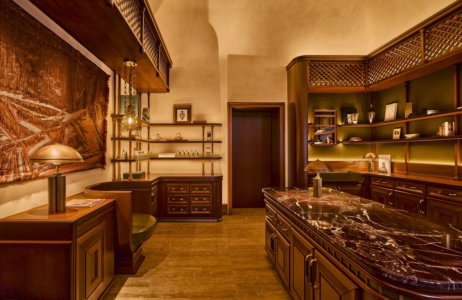 The spa’s reception with a marble counter and the tiled hammam through the door