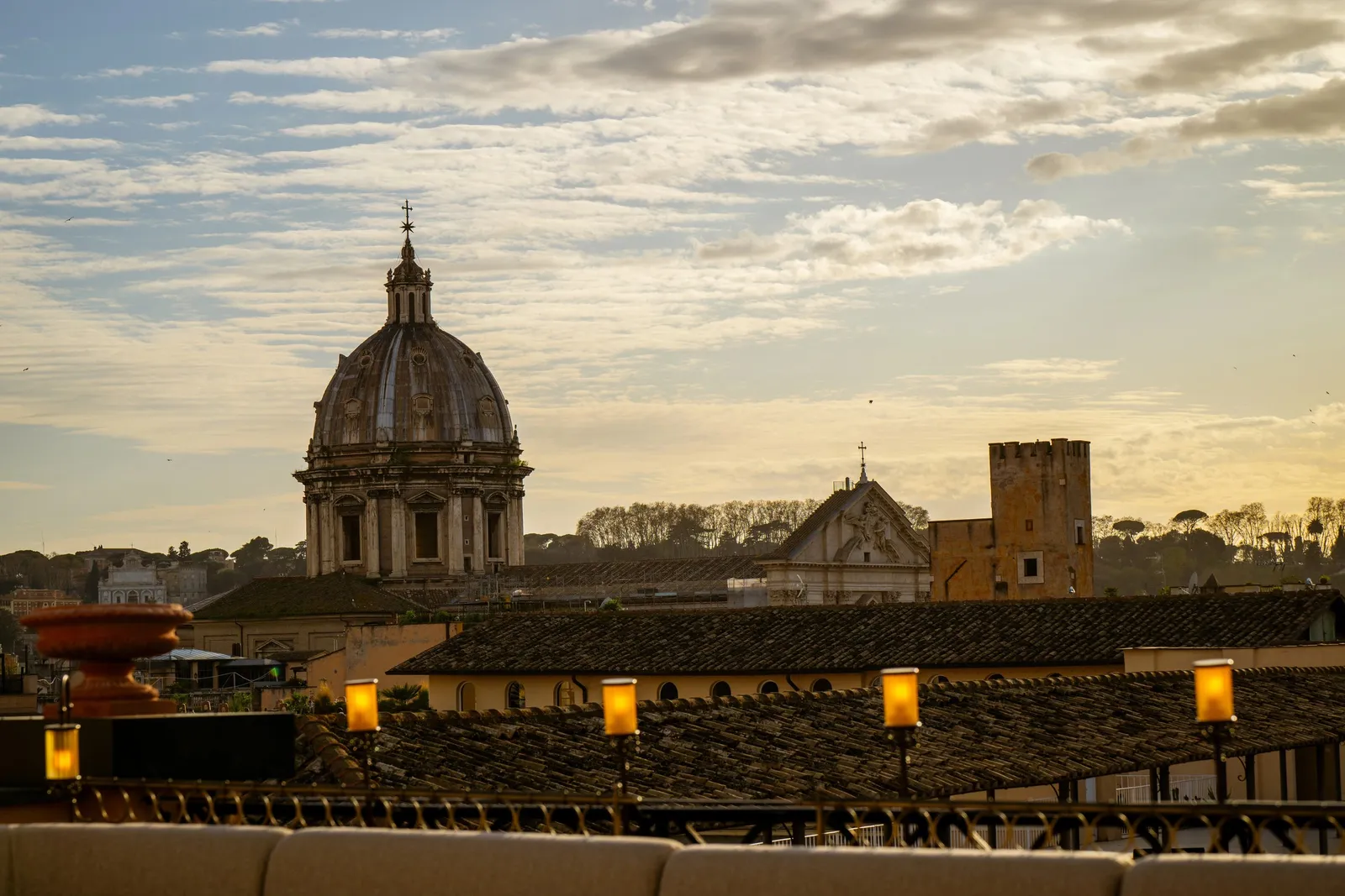 Rome’s rooftops and a dome at dusk from the hotel