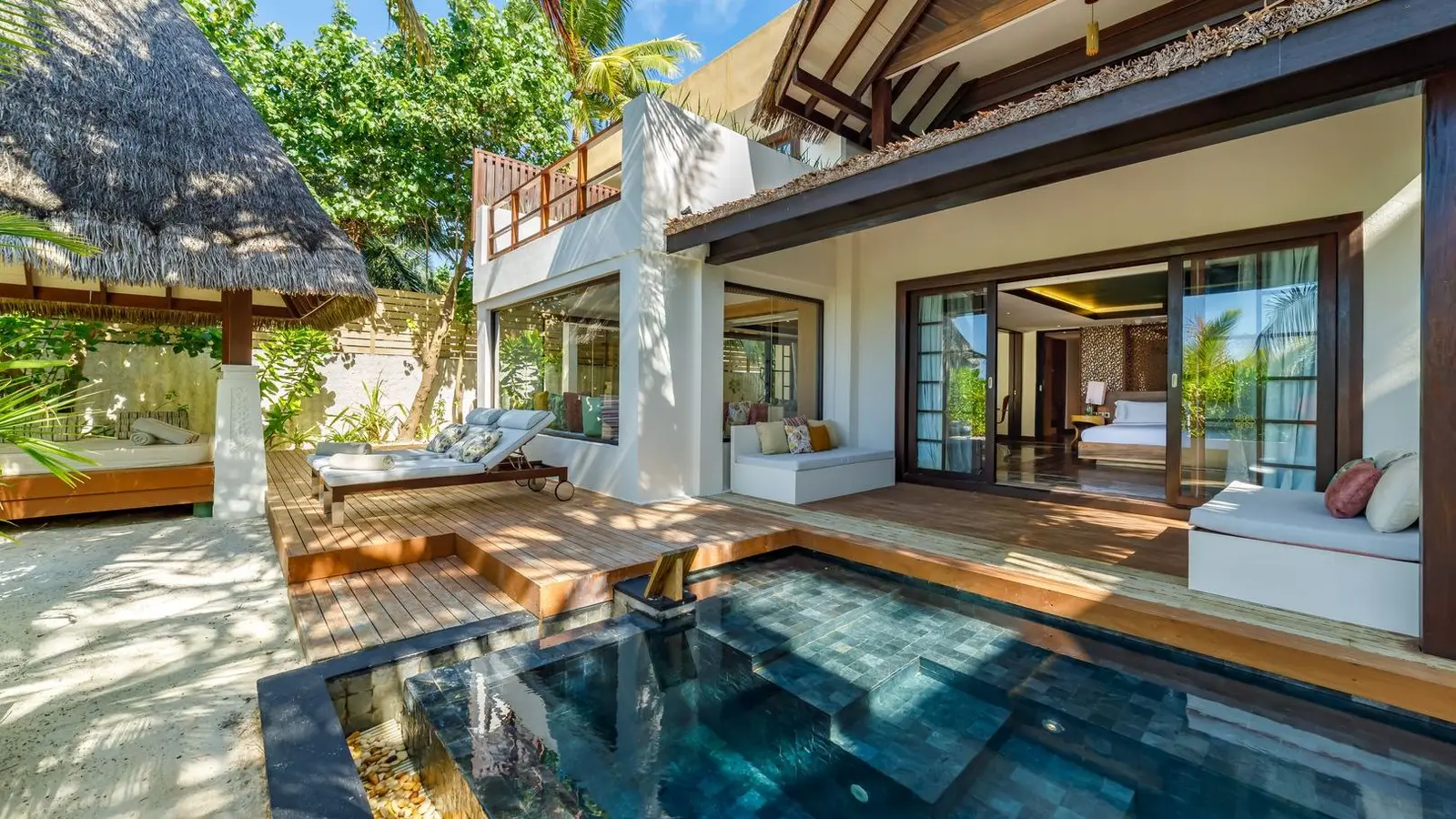 The 2-storey, 2-bedroom Earth Pool RESERVE, open to its pool and loungers.