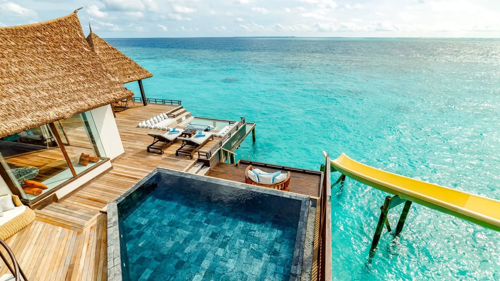 An Ocean Pool RESERVE’s infinity pool, its timber deck and the top of the slide over the sea.