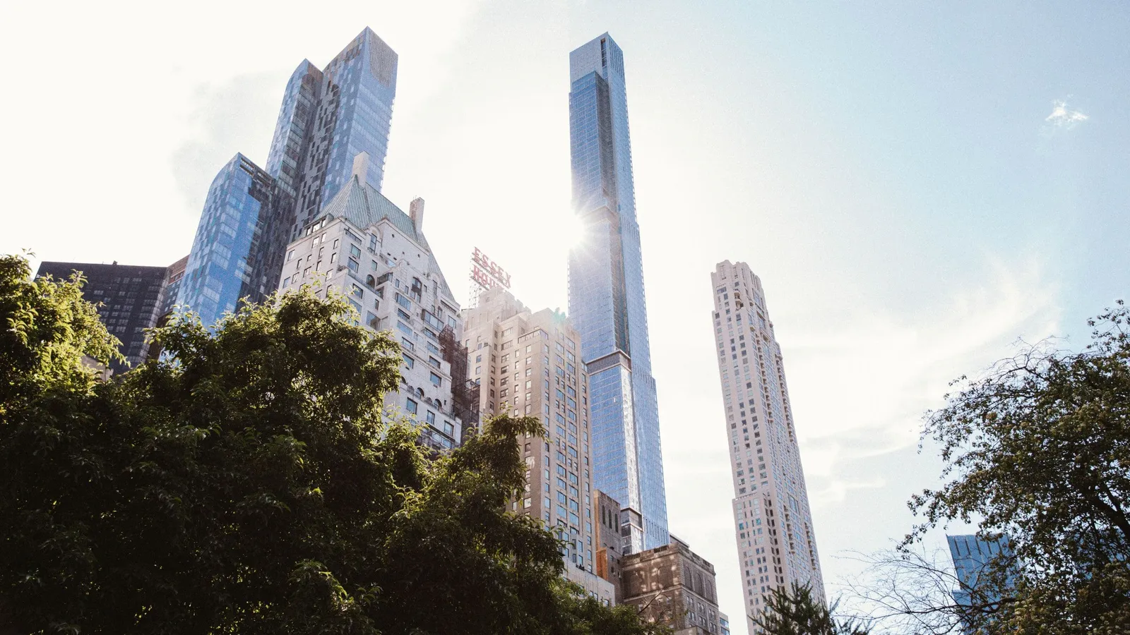 Park Hyatt New York tower seen beyond the trees of Central Park