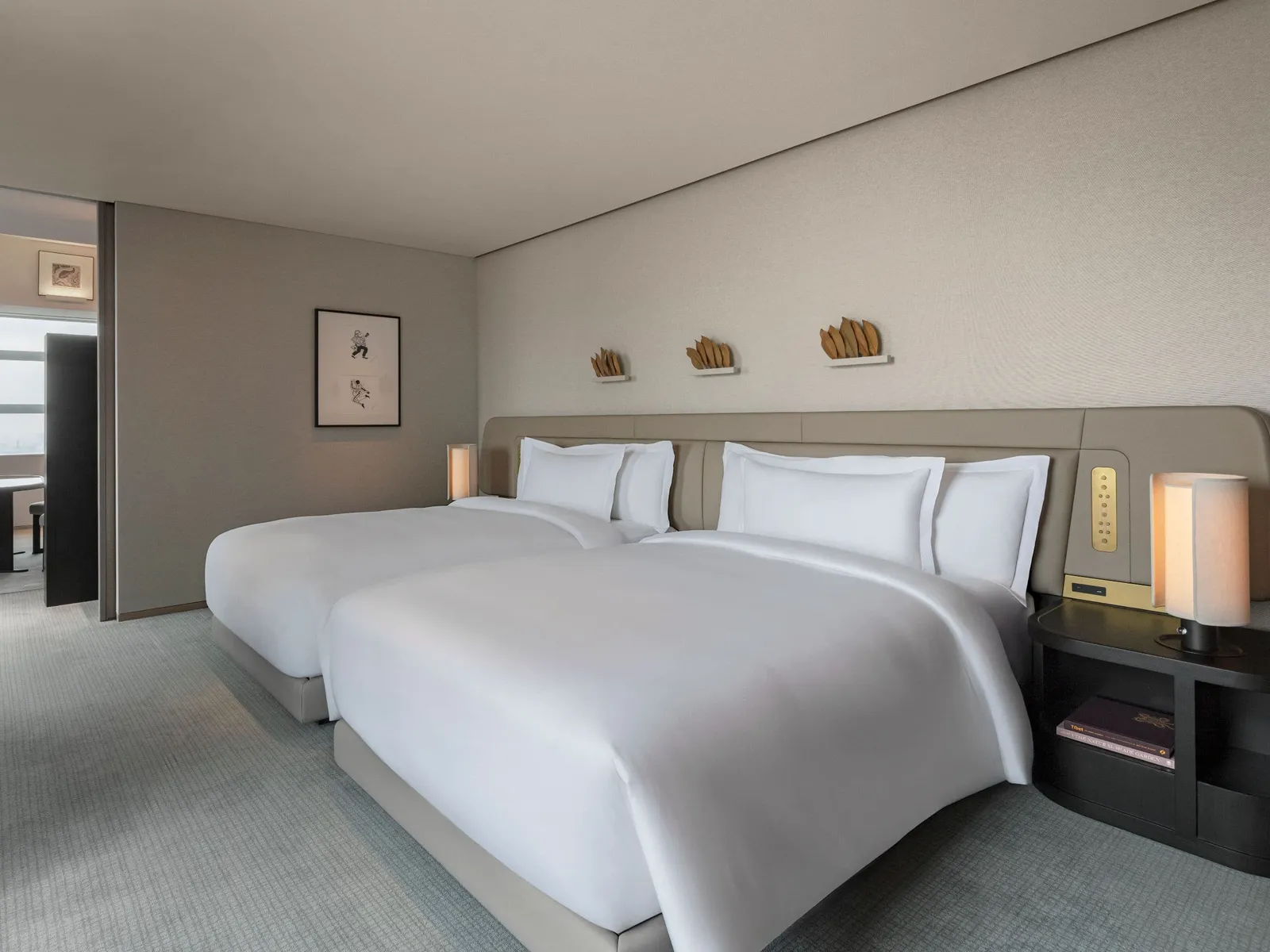 The Park Deluxe Suite bedroom with 2 double beds and paper lamps on the bedside tables.