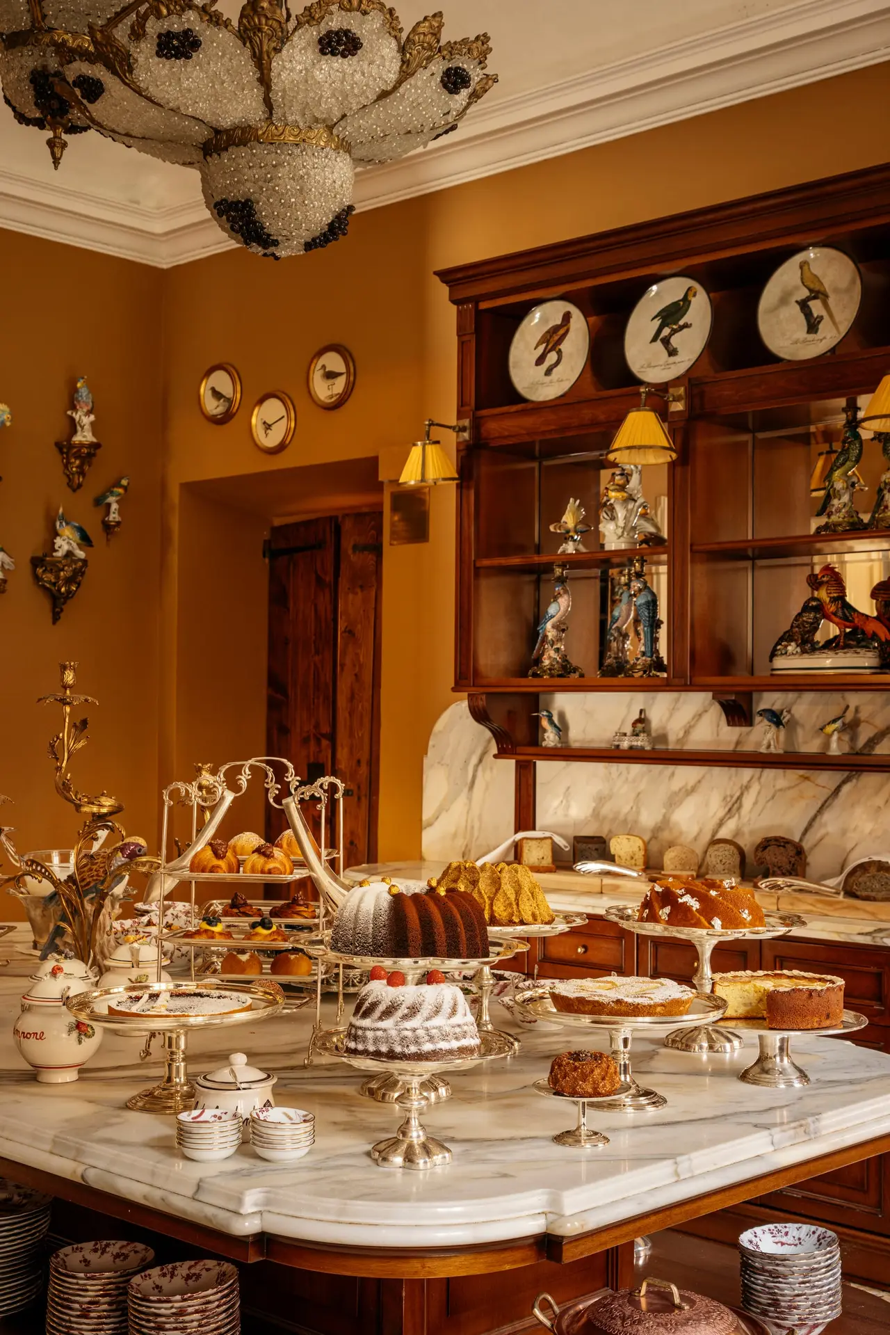 Cakes and pastries laid out on the kitchen counters at breakfast