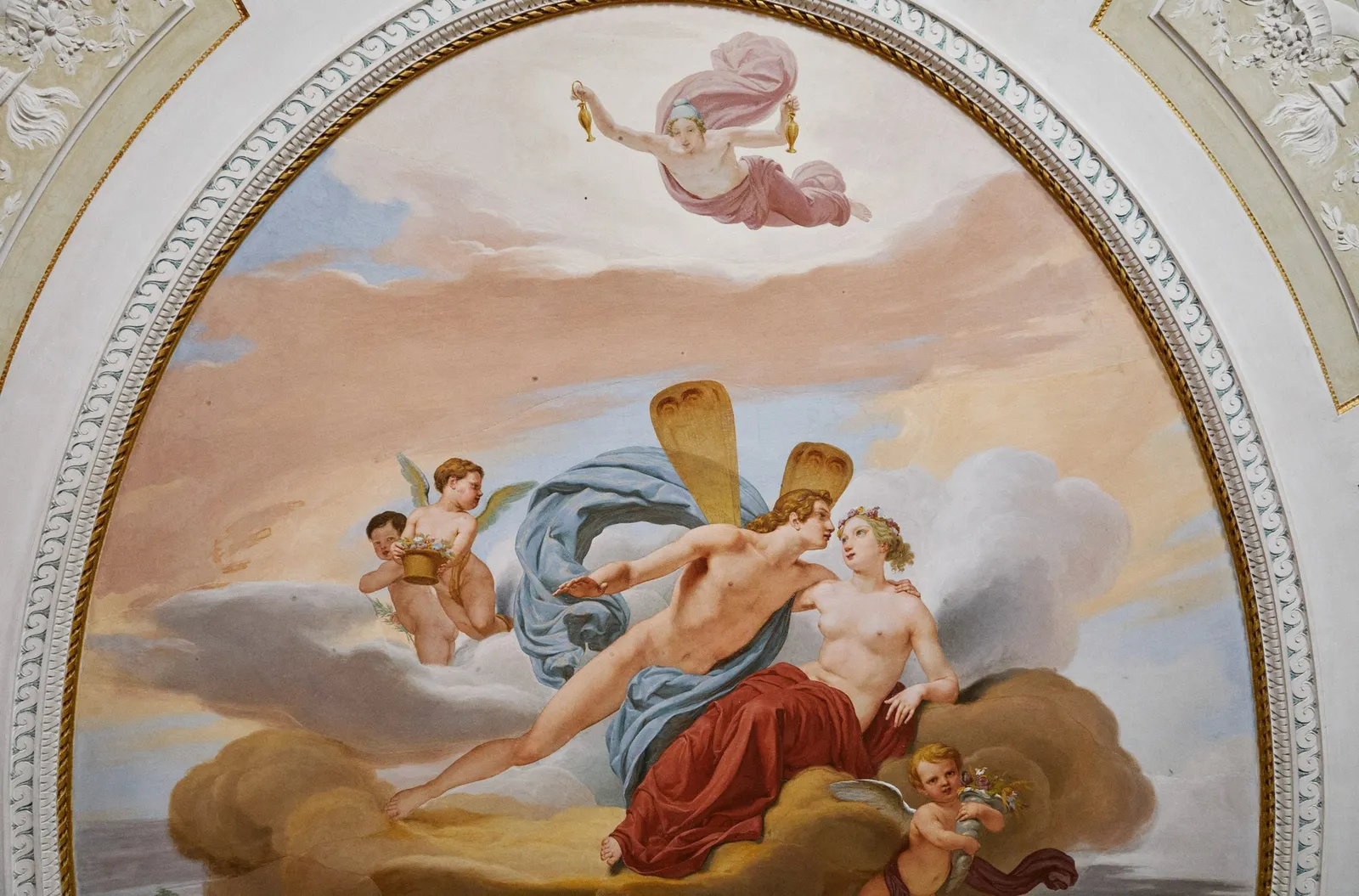 A fresco of gods among clouds in the Sala Ovale