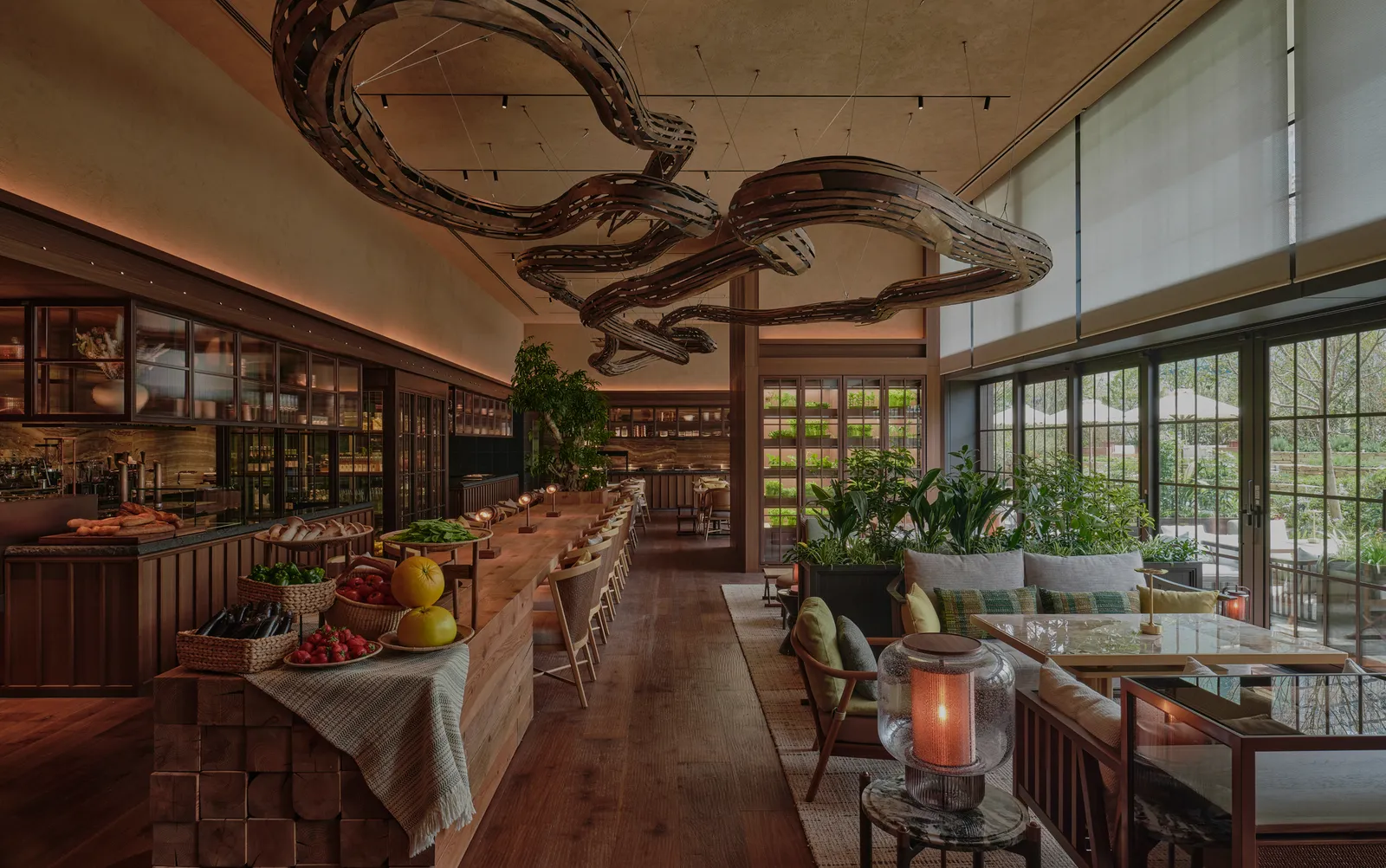 P72: a produce counter under a sculpted wooden ceiling, tables by the garden windows