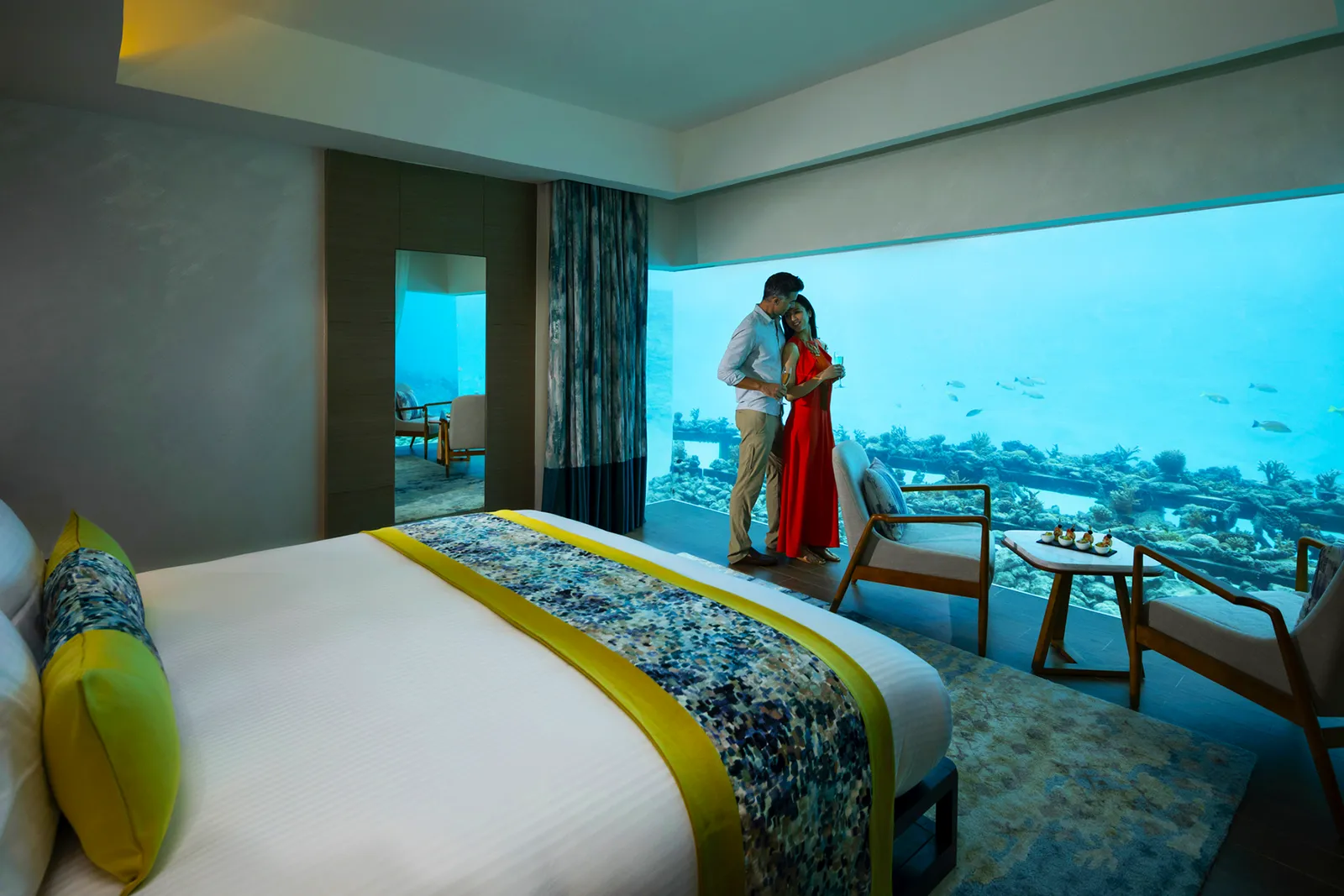 The Aqua Villa’s underwater bedroom: the bed facing the window onto the reef and its fish.