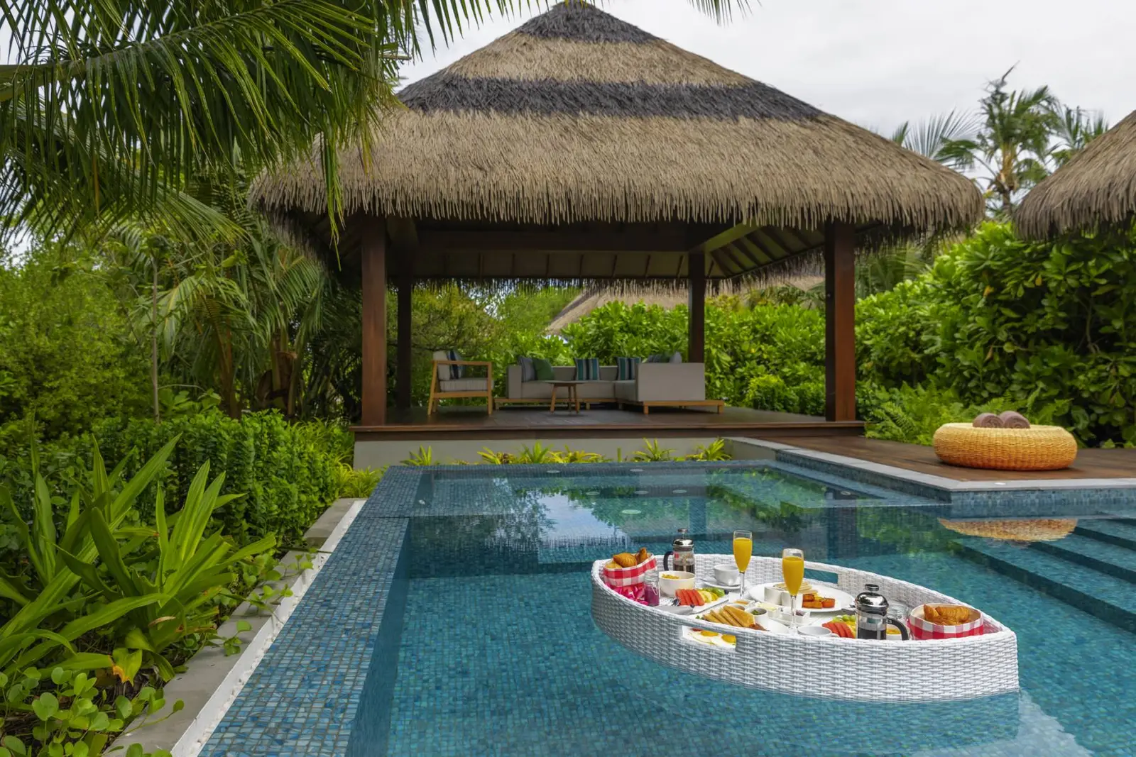 The Two Bedroom Beach Pool Villa’s pool, a floating breakfast beneath the cabana.
