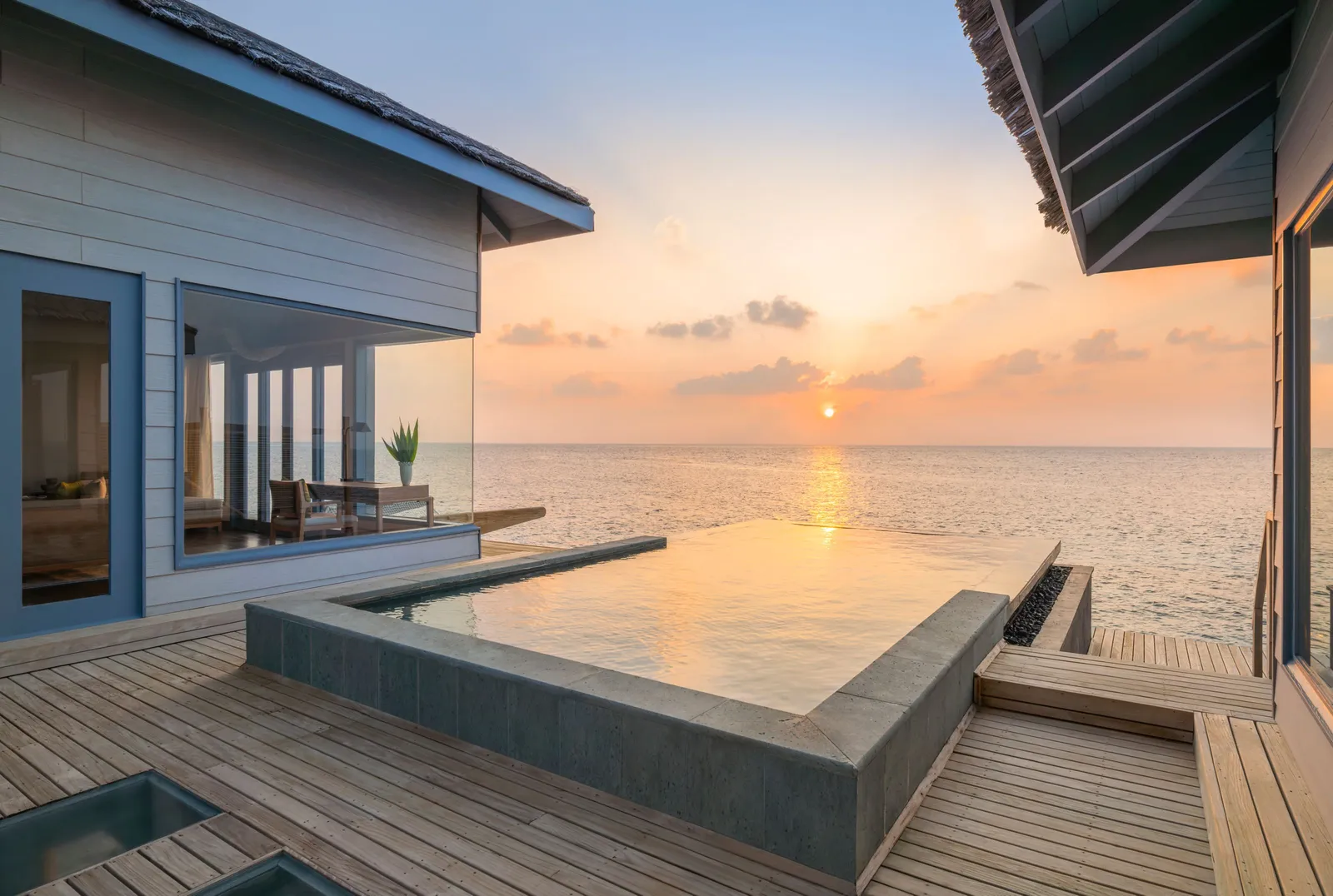 The infinity pool of a sunset-facing beach villa