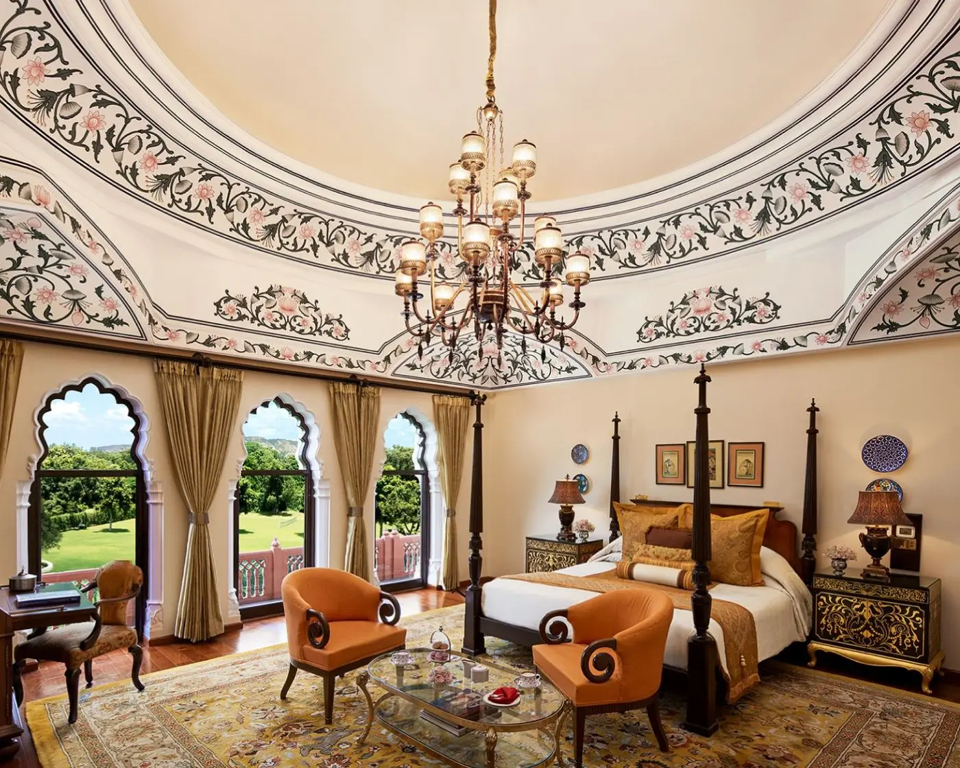 A Historical Suite with a painted ceiling, chandelier and arched windows onto the garden