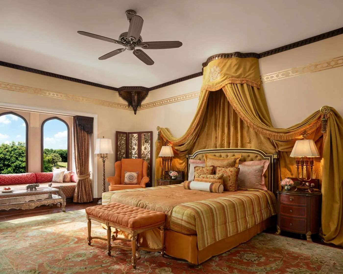 A Palace Room with a four-poster bed and gold drapes
