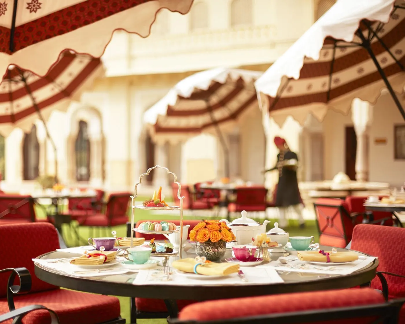 Tables laid for tea under the verandah’s parasols