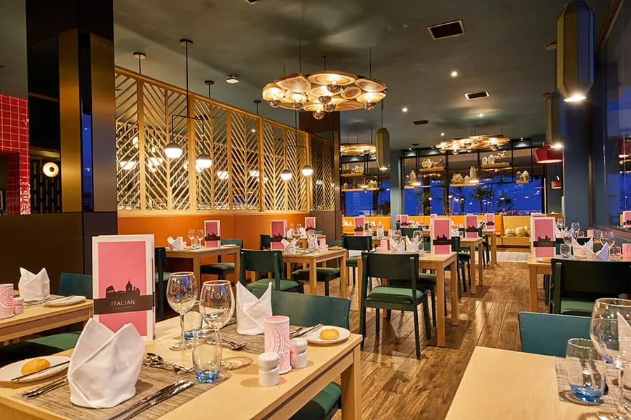Sofia, the Italian restaurant, with its laid tables and pendant lamps.