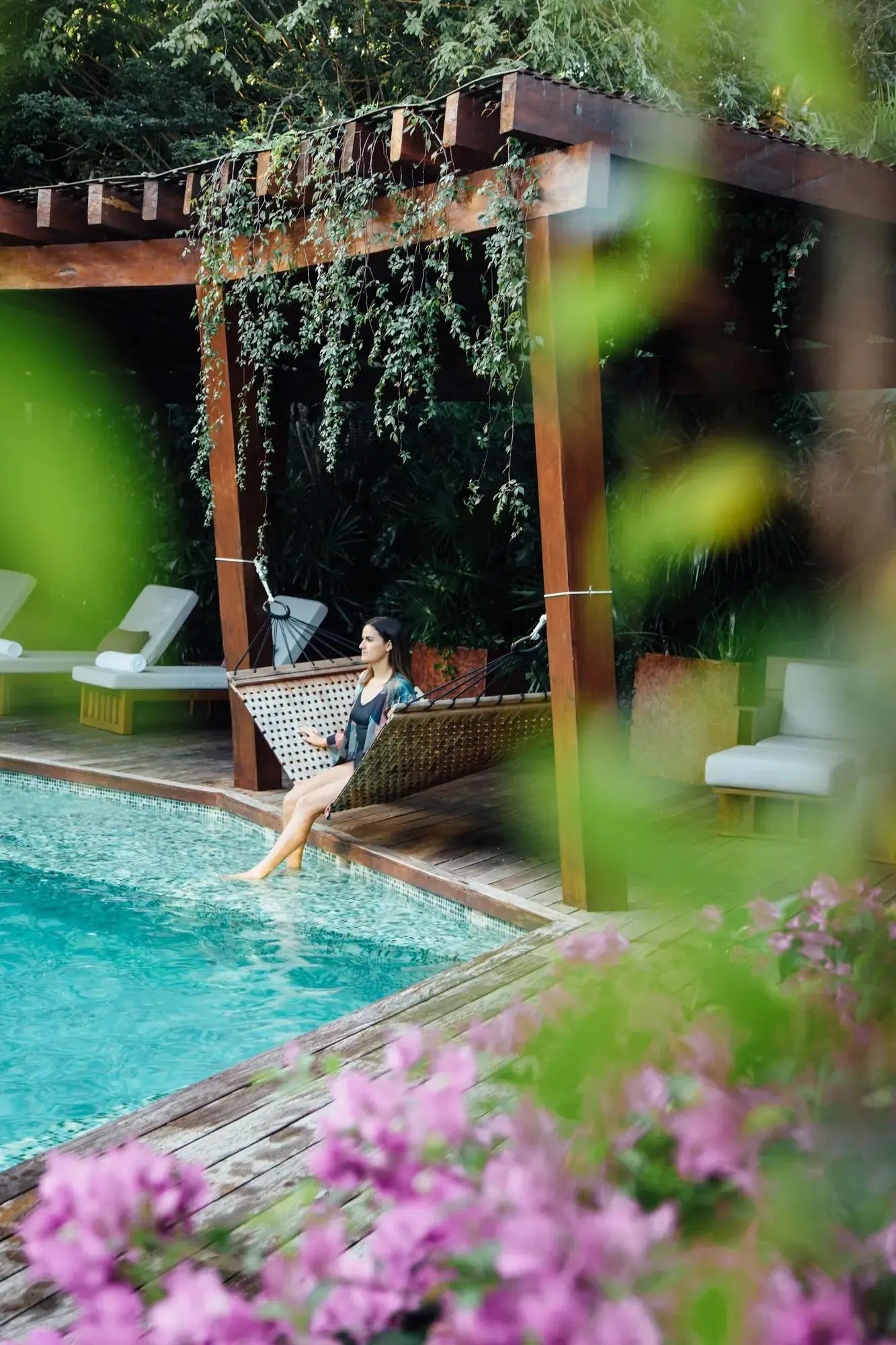 The Sense spa pool among flowers and greenery