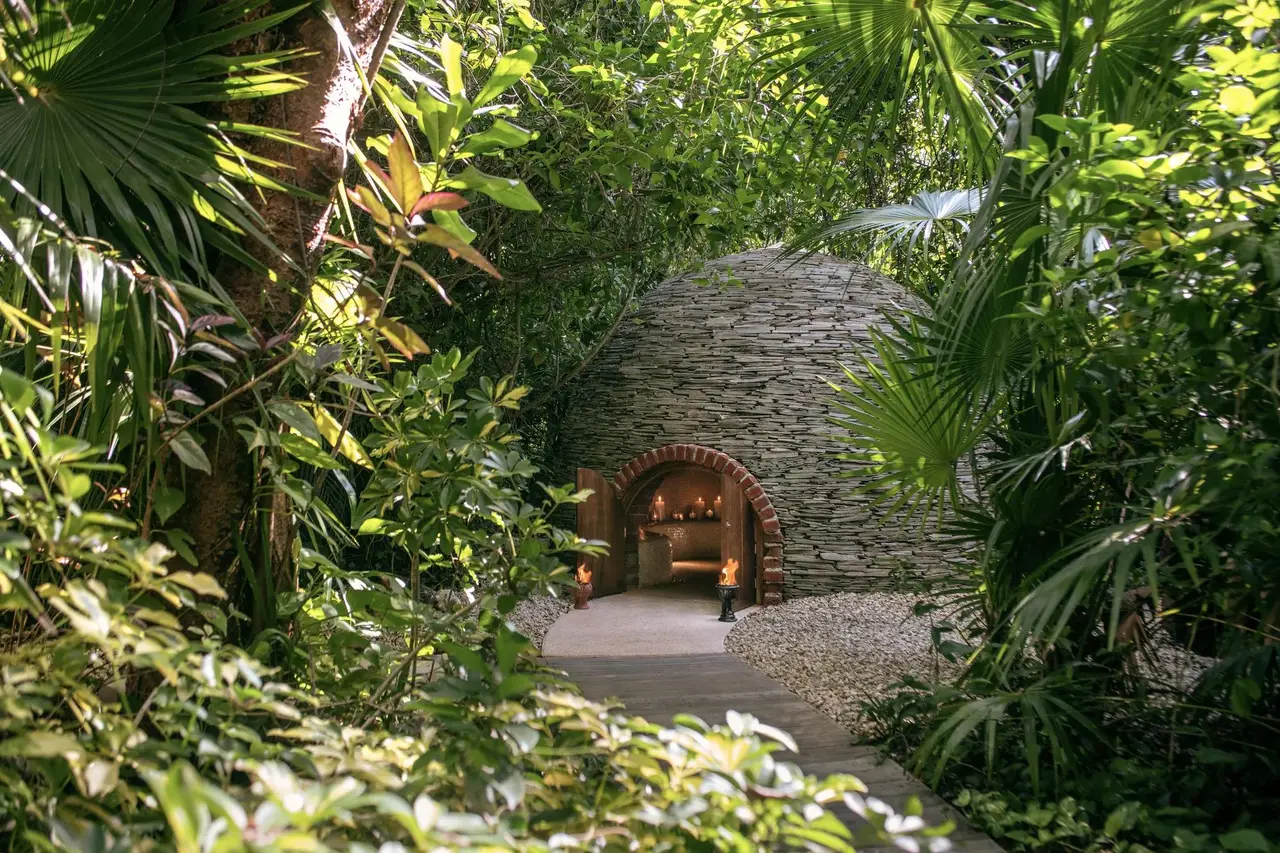 The spa’s stone temazcal in the jungle