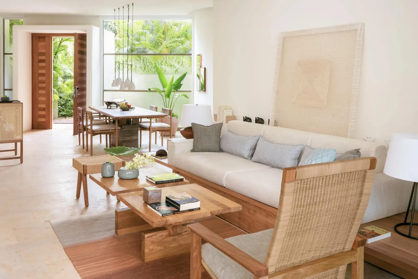 The living and dining room, a sofa and doors to the garden