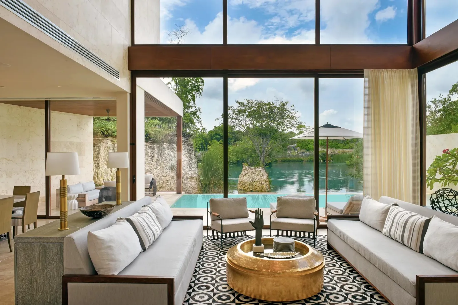 The double-height living room open to the pool