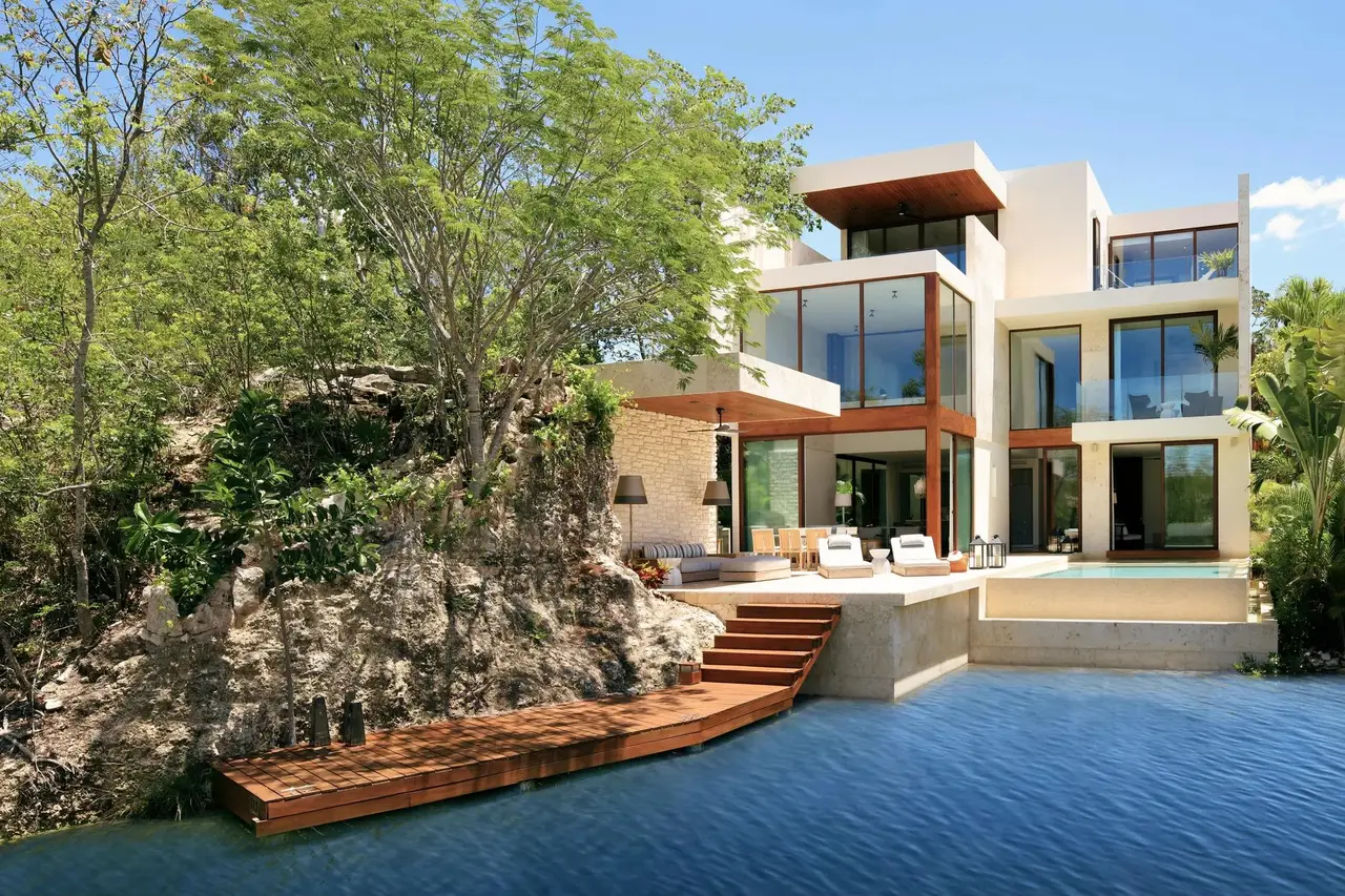 The multi-storey villa above its dock on the lagoon