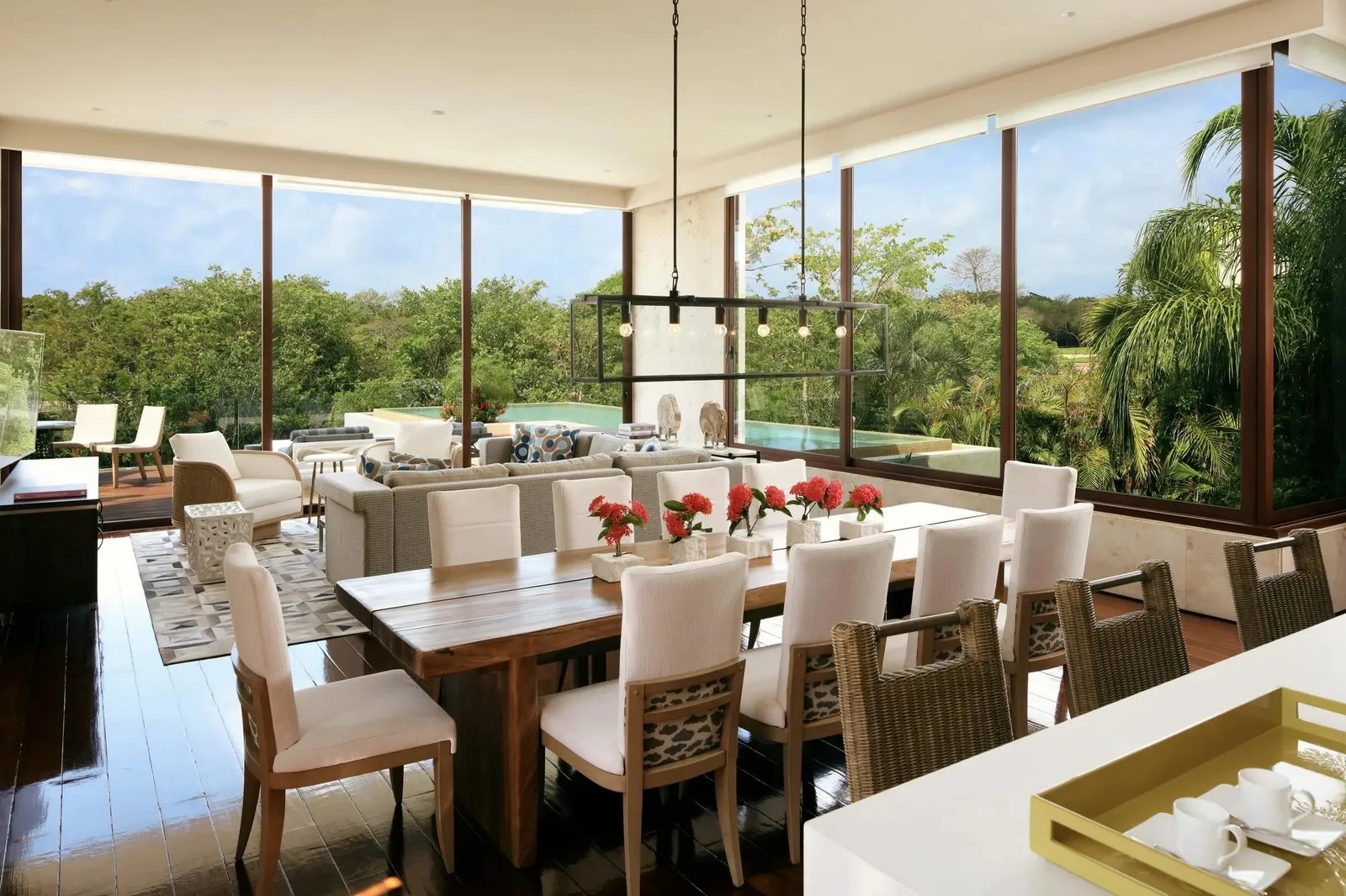 The dining room with walls of glass onto the greenery