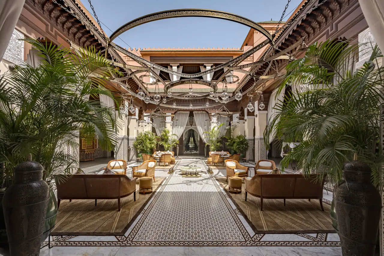 The lobby atrium, with carved white columns and a fountain