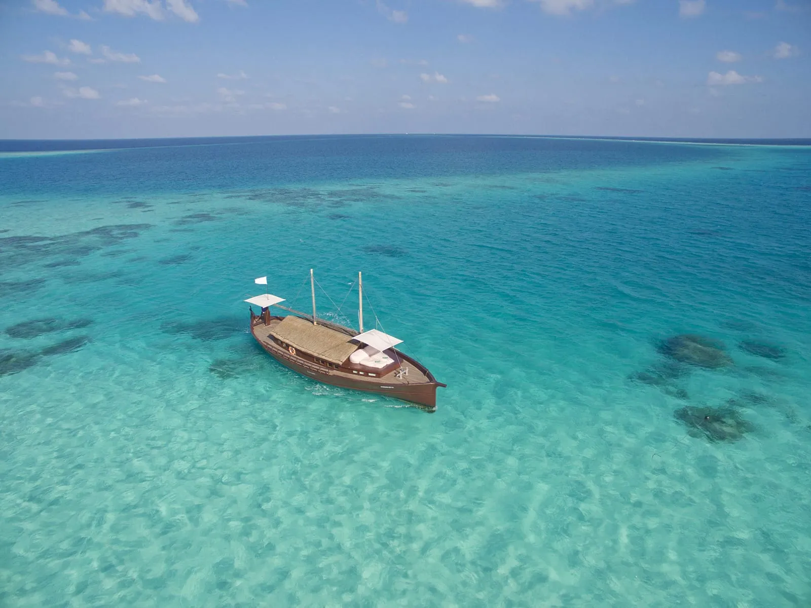 The Safari boat anchored in the lagoon.