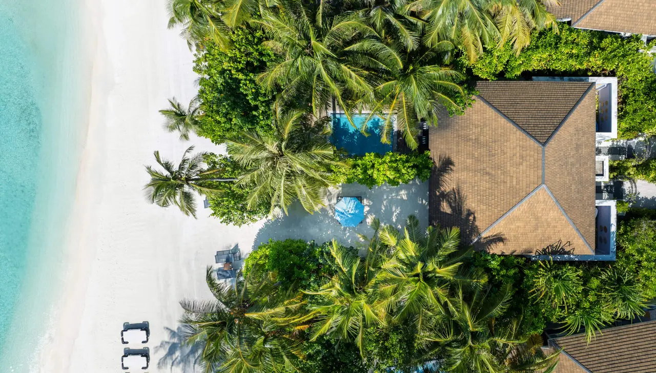The 2-Bedroom Beach Villa with Pool from above: its roof, its pool and the beach alongside