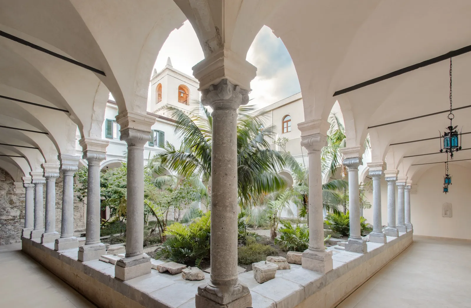 Columns and palms in the San Domenico Palace cloister