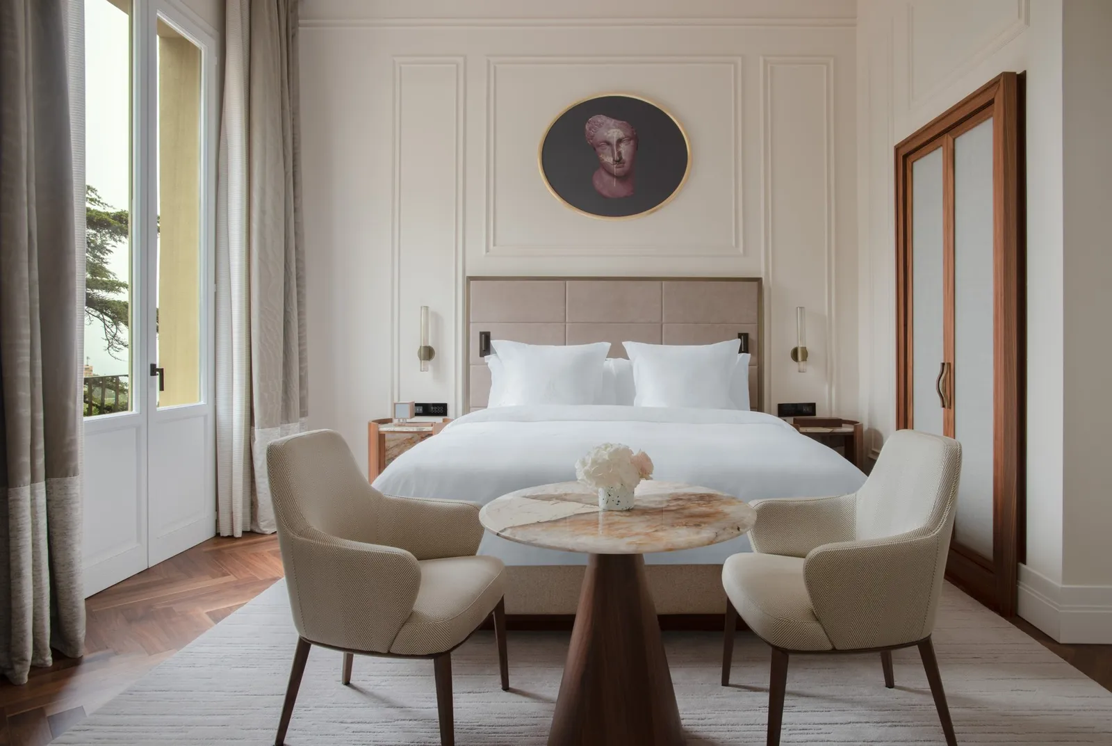 Bed and table in a Deluxe Room