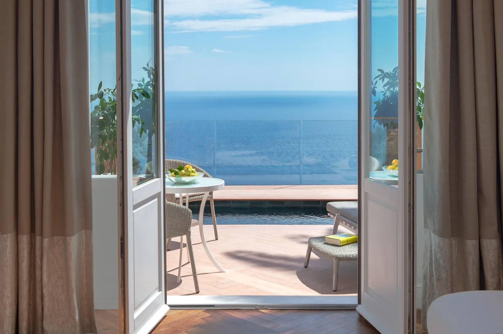 Doorway onto the pool terrace of an Executive Suite Plunge Pool, Sea-View