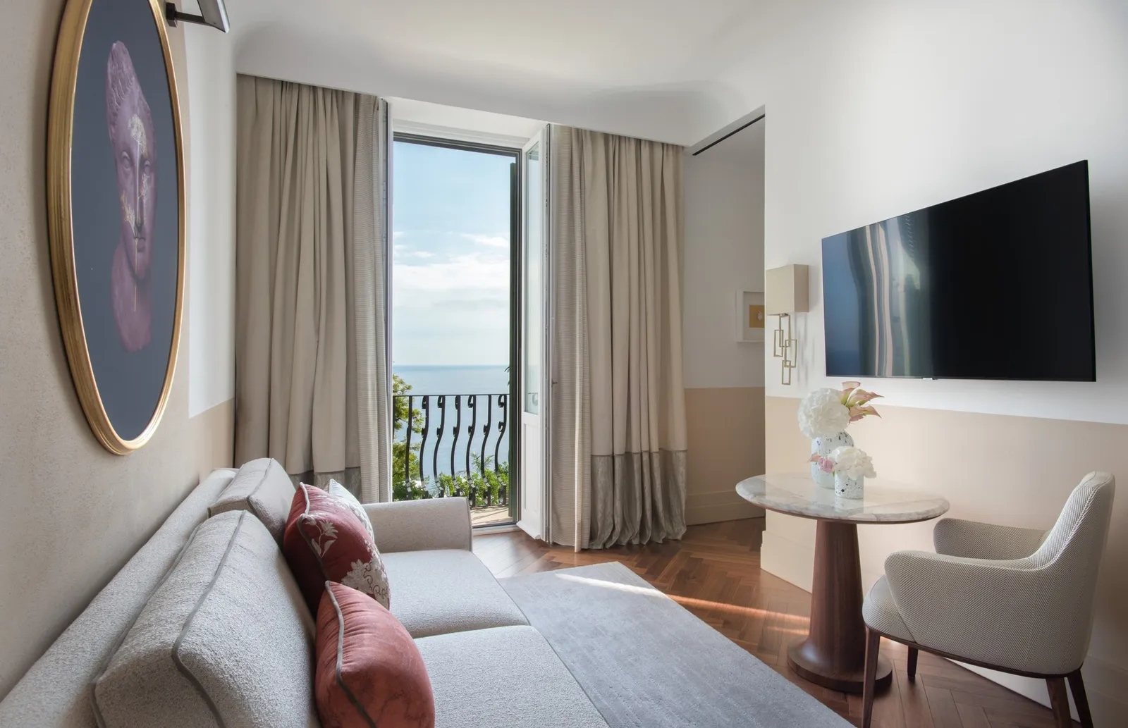 Sofa and sea-facing window in a Sea-View Studio Suite