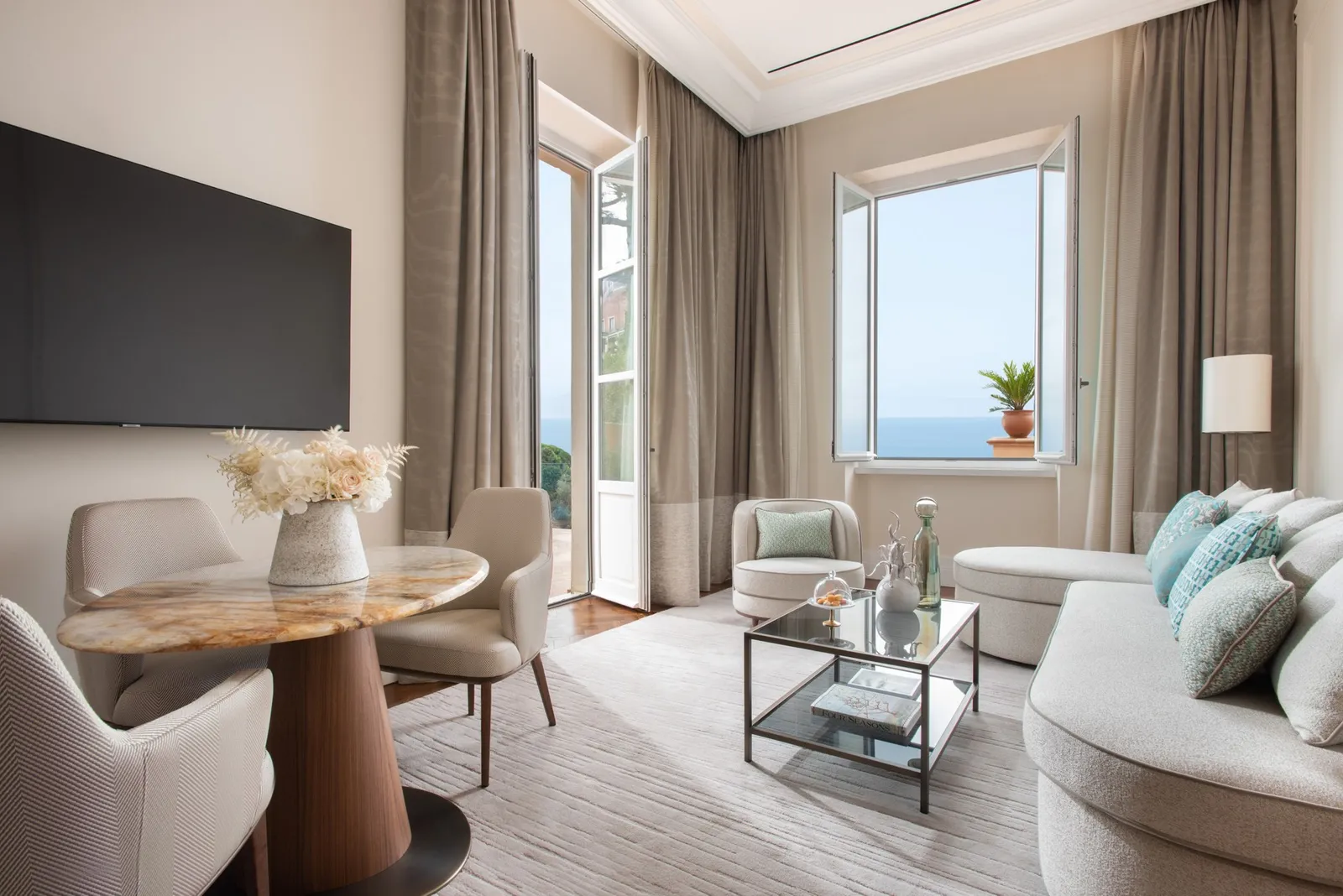 Sofa, armchair and table in the Teatro Suite living room
