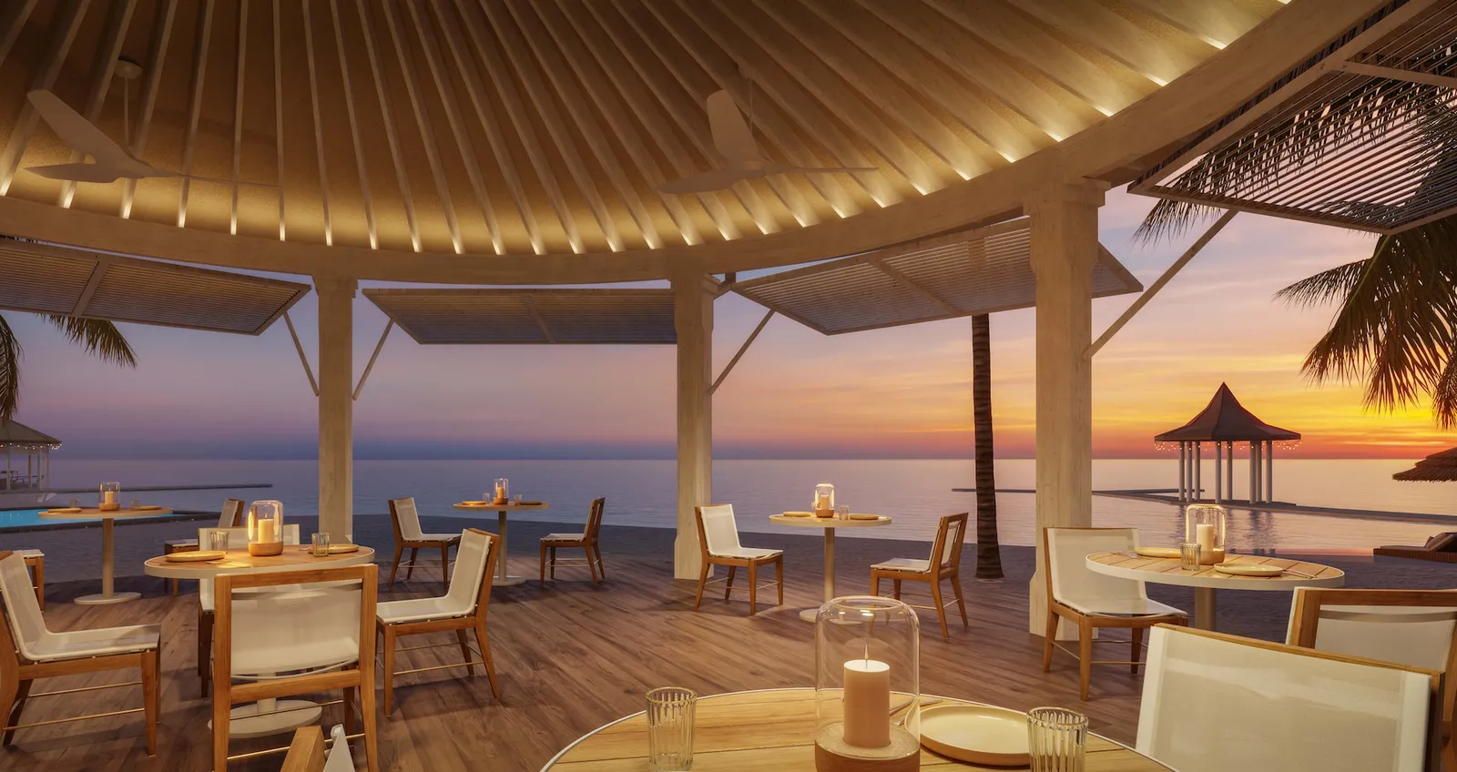 Official rendering of the resort after the works: an open-air restaurant under a radial timber roof, tables on the deck and the sunset over the sea.