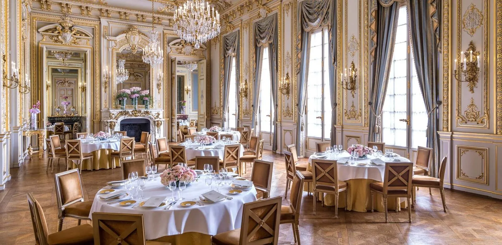 The historic salons, with laid tables, chandeliers and gilded decoration