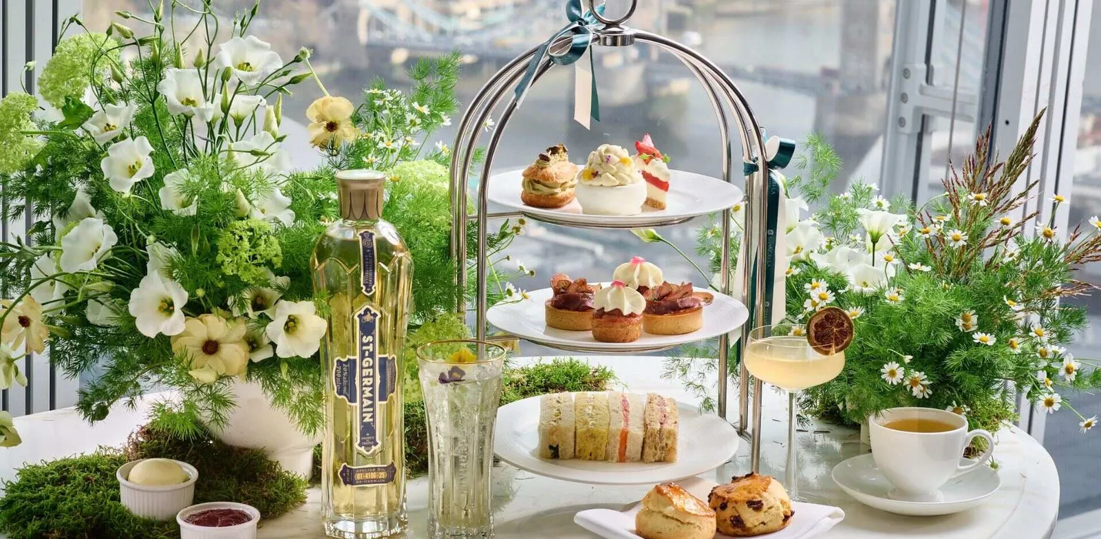 The St-Germain afternoon tea stand among white flowers and leaves