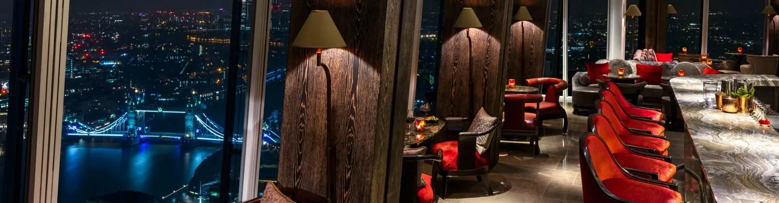 GŎNG’s bar in the evening, with London’s lights beyond the glass
