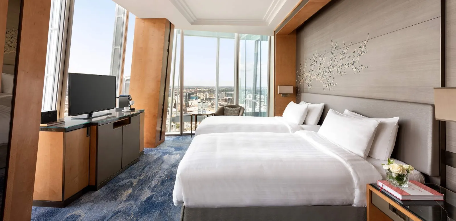 The Deluxe City View Room with 2 beds and the city to the north