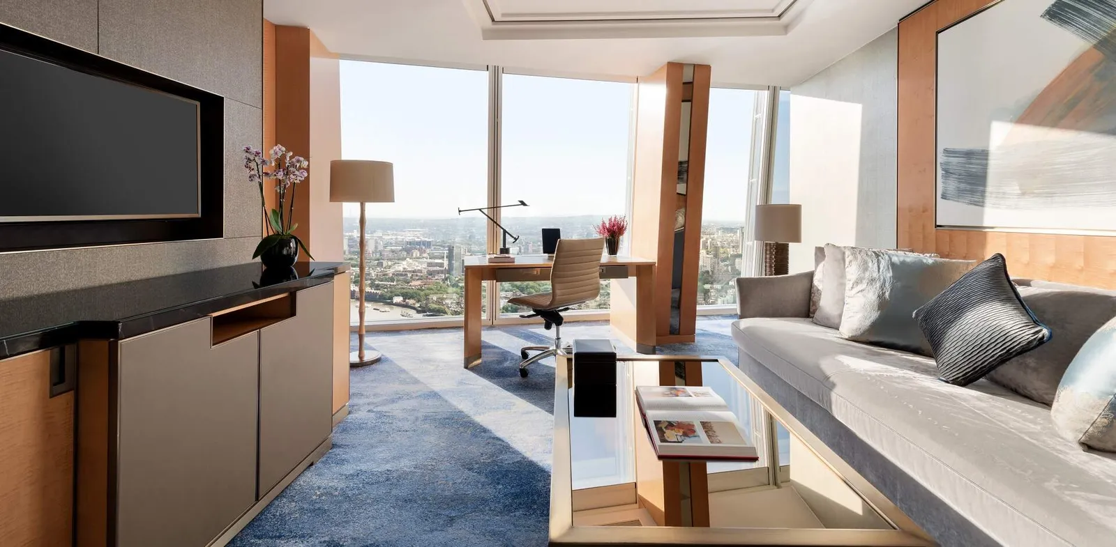 The Iconic Shard Suite’s living room, with a desk at the window