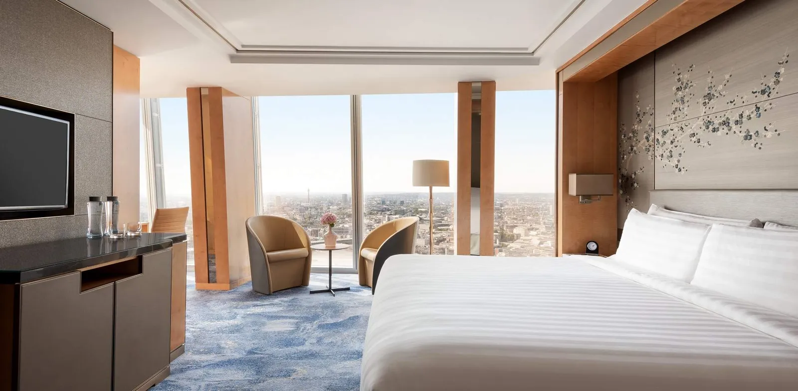 The Premier City View Room, a king bed facing the glass