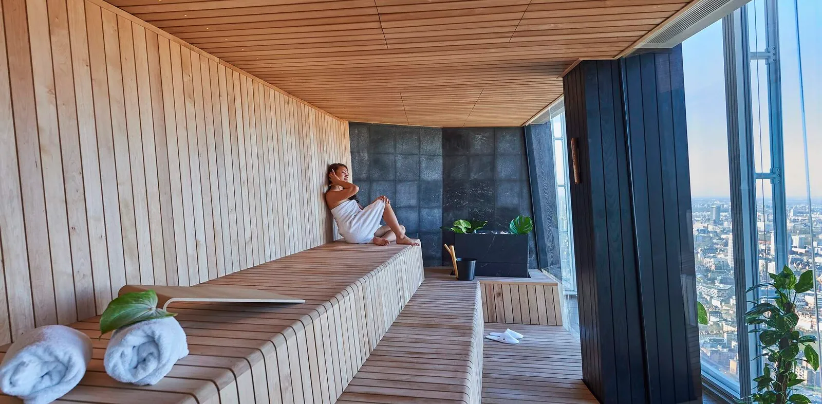 The timber-lined Sky Sauna, with its window on the city